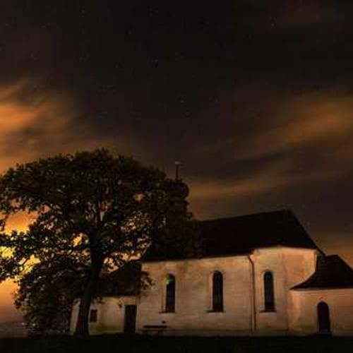 A volunteer providing medical check-up to an elder.